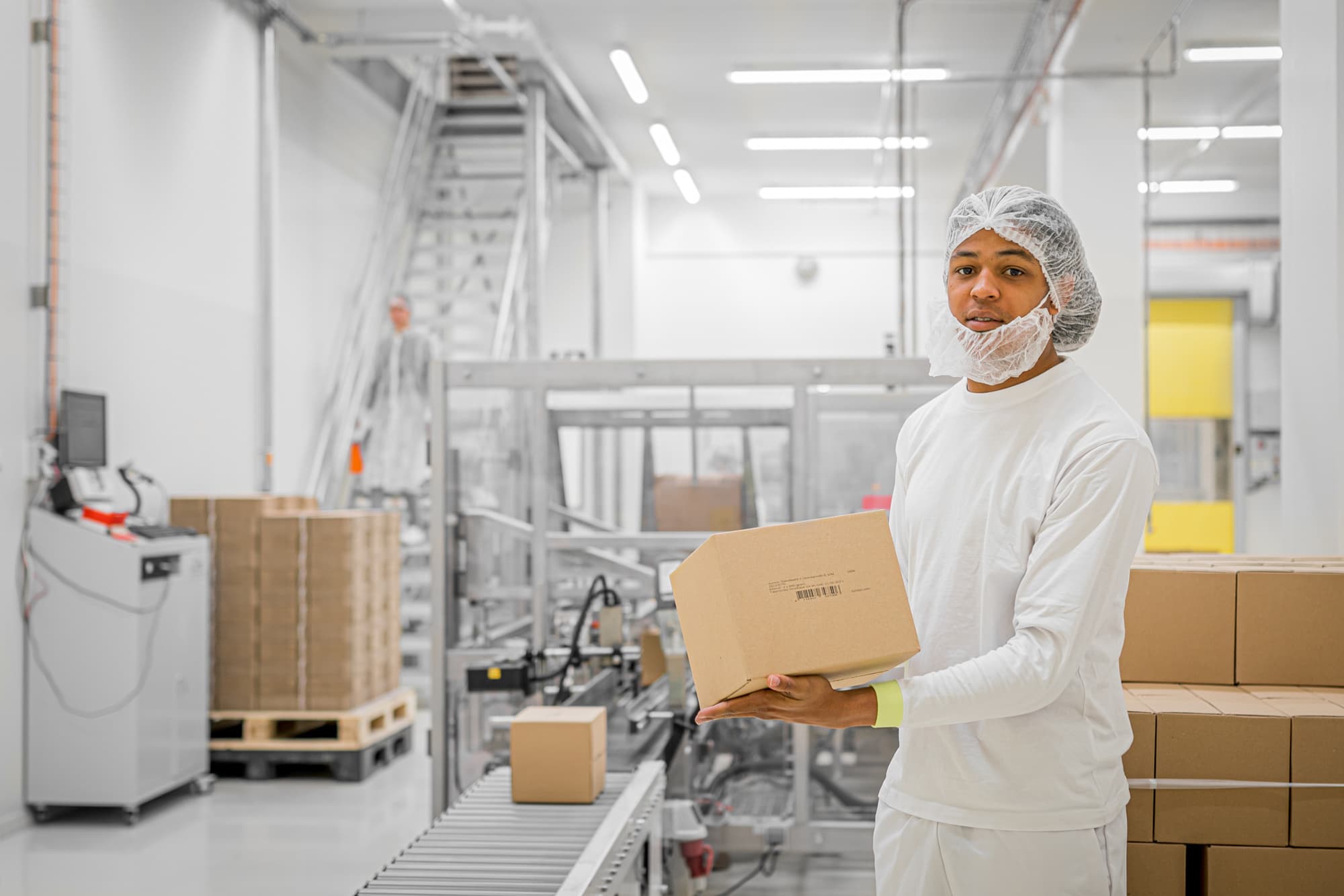 Employee in the high-care production area for infant nutrition